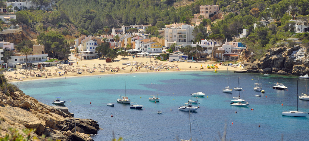 Main photo of Cala Llonga beach in the east of Ibiza for our September blog - everything ibiza properties